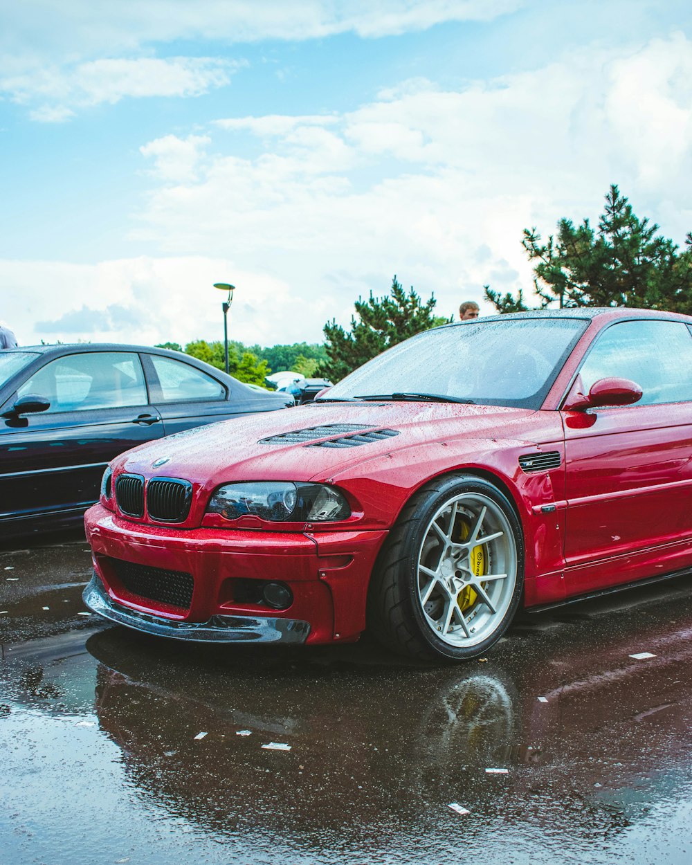 a red sports car parked in a parking lot