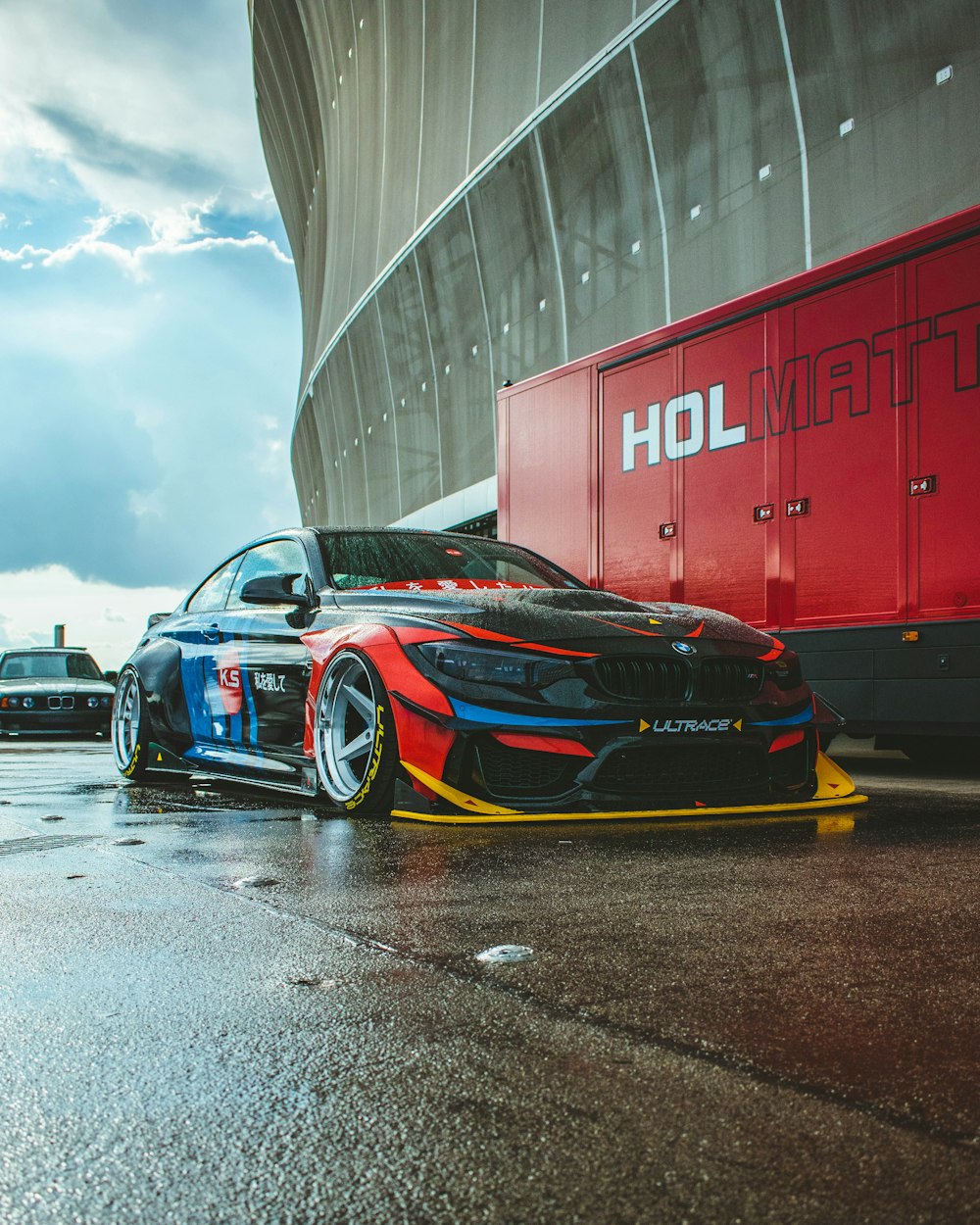 a car parked in front of a large building