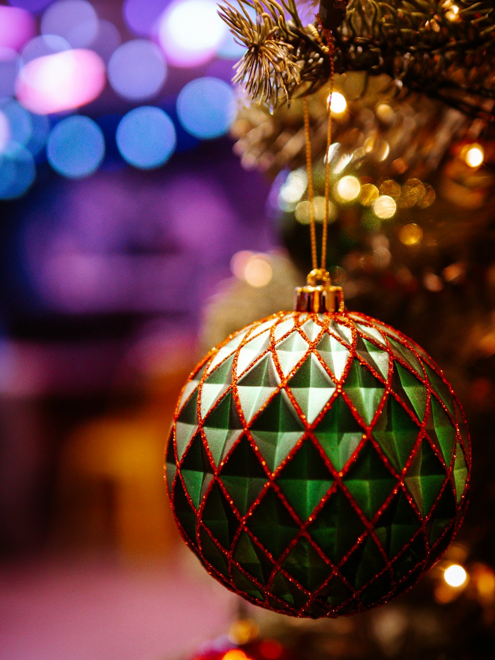 a christmas ornament hanging from a christmas tree