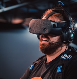 a man with a beard wearing a headset