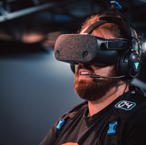 a man with a beard wearing a headset