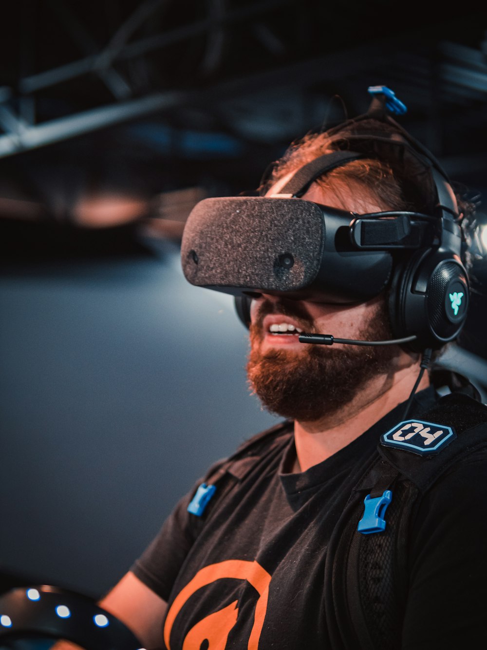 a man with a beard wearing a headset