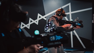 a man with a gun and a video game controller