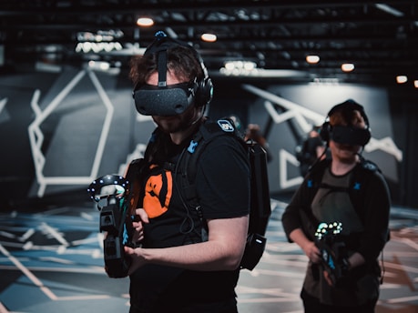 a group of people in a room with virtual headsets representing digital experience agency designs