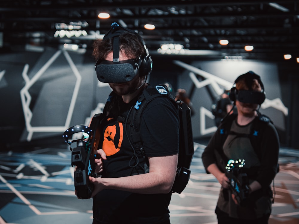 a group of people in a room with virtual headsets