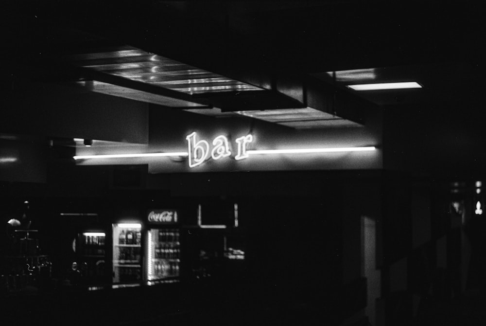 a black and white photo of a bar