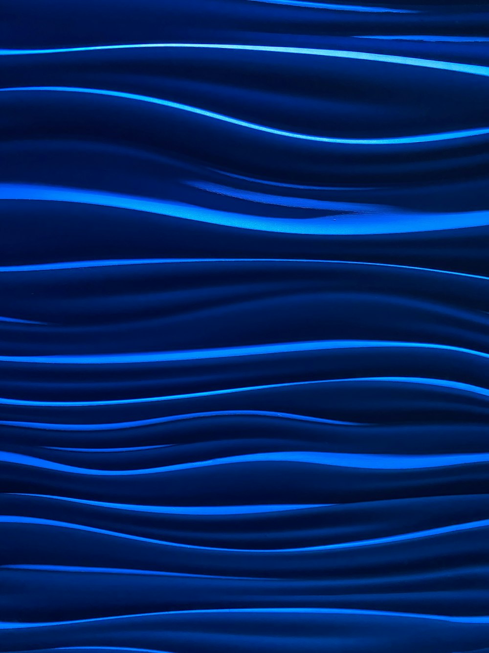 a blue abstract background with wavy lines