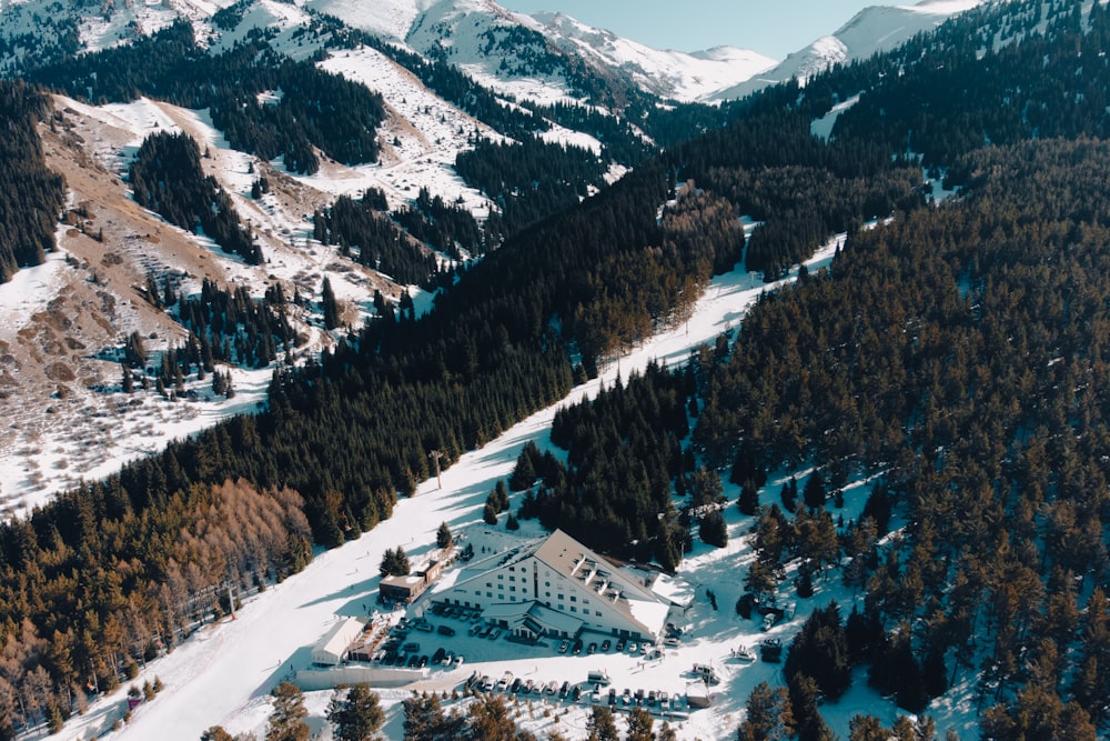 an aerial view of a house in the mountains