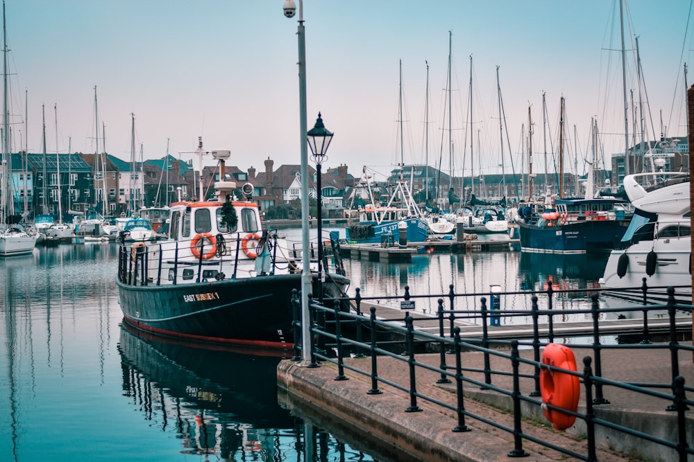 a harbor filled with lots of boats on top of water