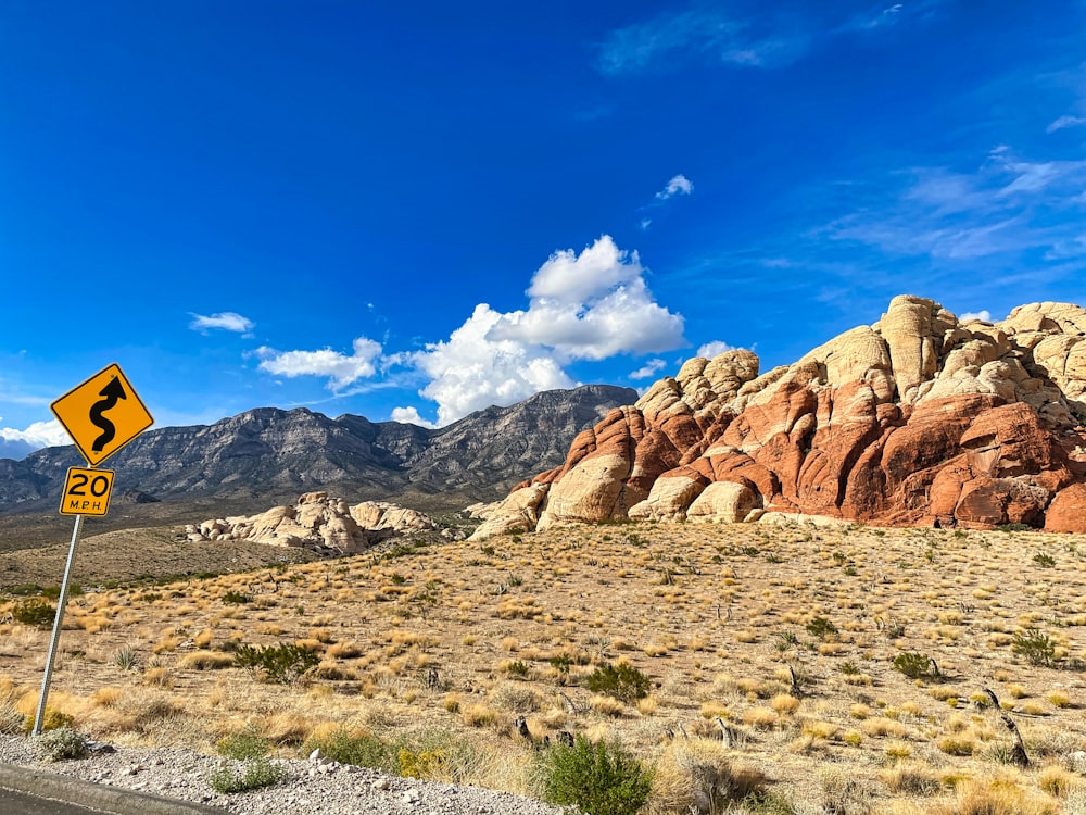 a road sign in the middle of a desert