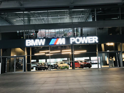 Front view of a modern BMW and Mercedes repair garage with a welcoming service desk