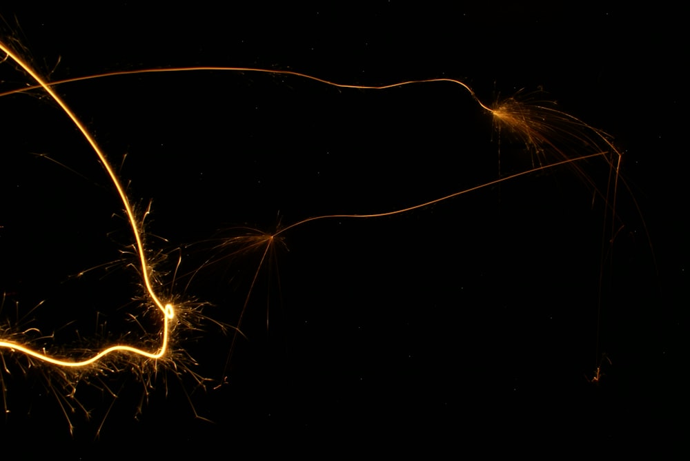 a close up of a sparkler on a black background