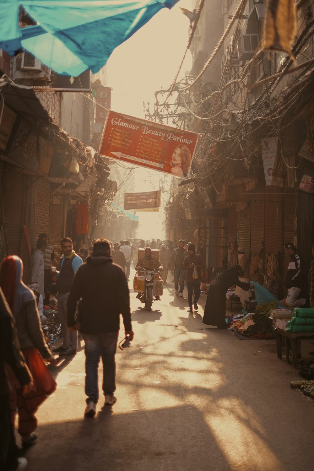 a group of people walking down a street