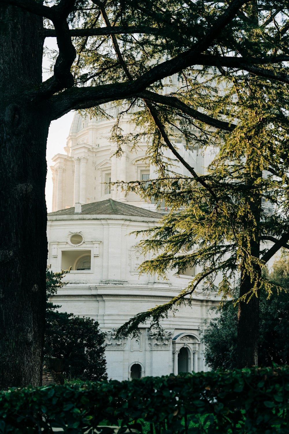 a large white building with a clock on it's side