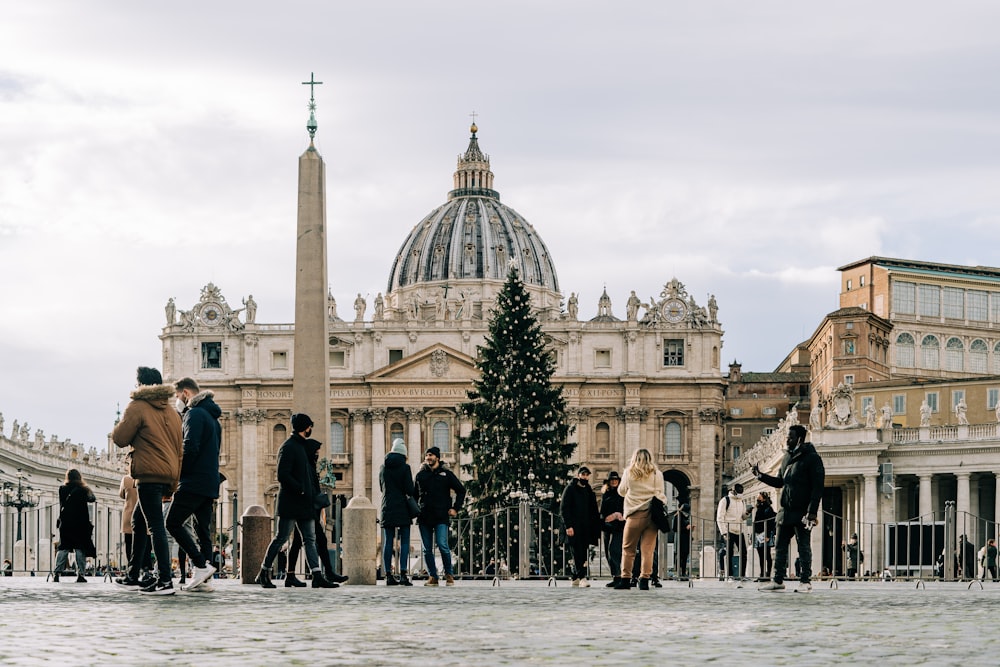 a group of people standing in front of a building