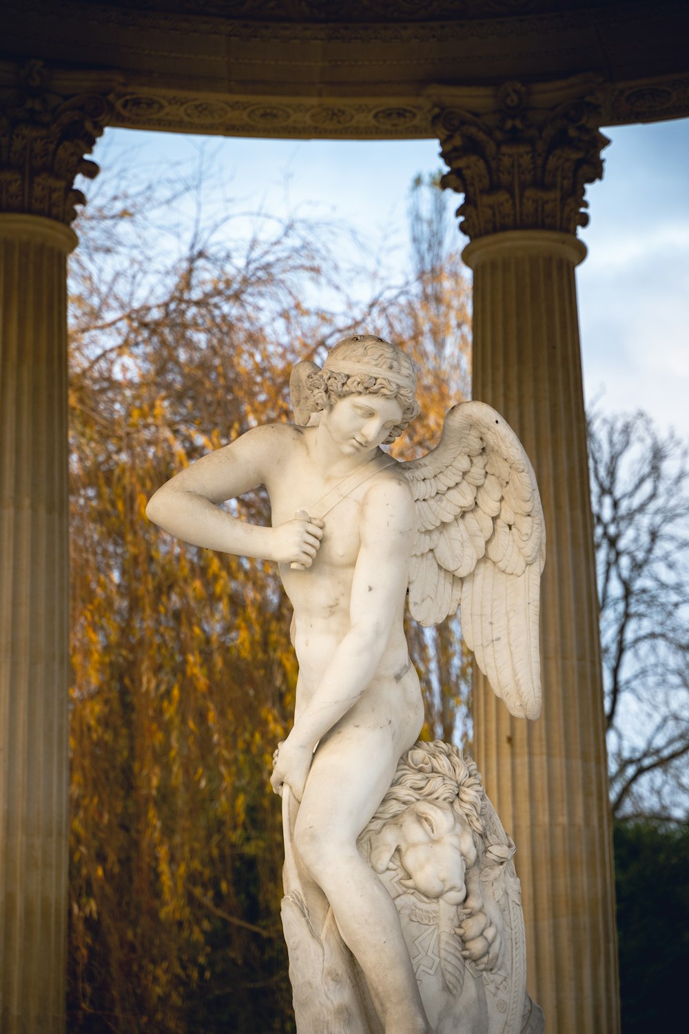 a statue of a man with a bird on his arm