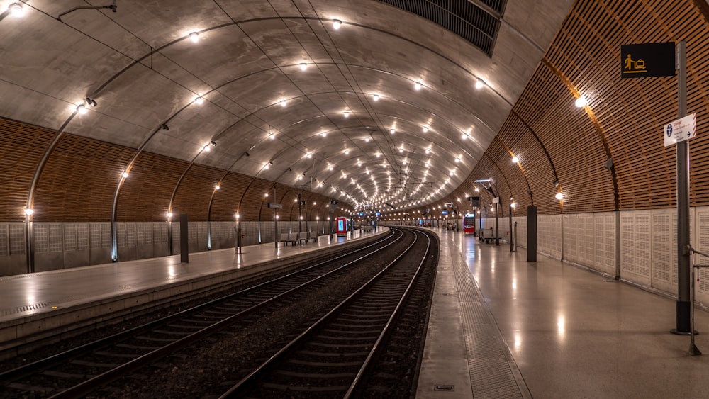 a train station with a train on the tracks