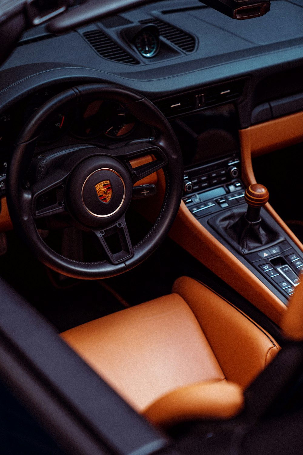 the interior of a car with a steering wheel and dashboard