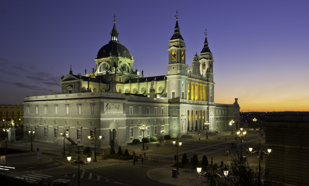 a large building lit up at night with lights on