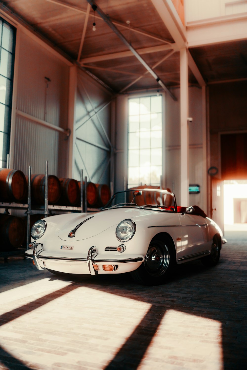 a white sports car parked in a garage