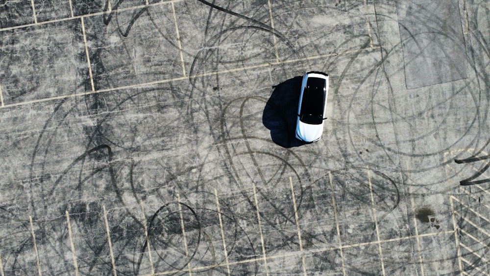 an aerial view of a car parked in a parking lot