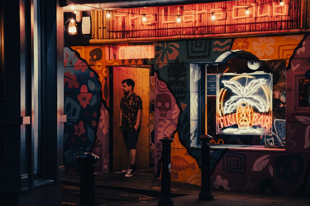 a man standing in a doorway of a building