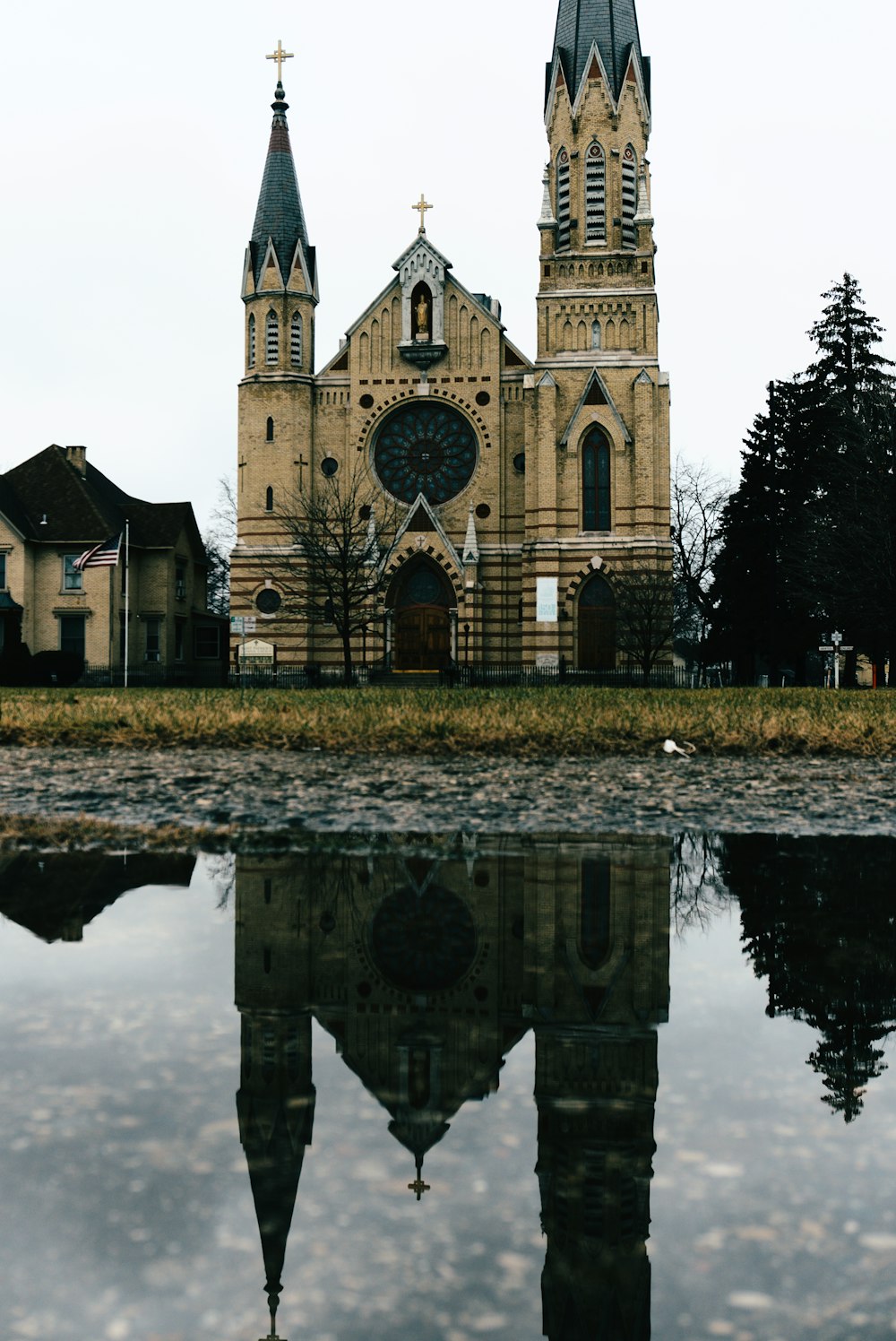 a reflection of a church in a body of water