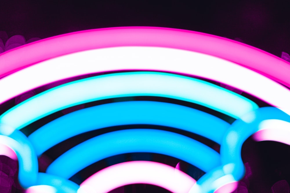 a close up of a neon lit object in the dark