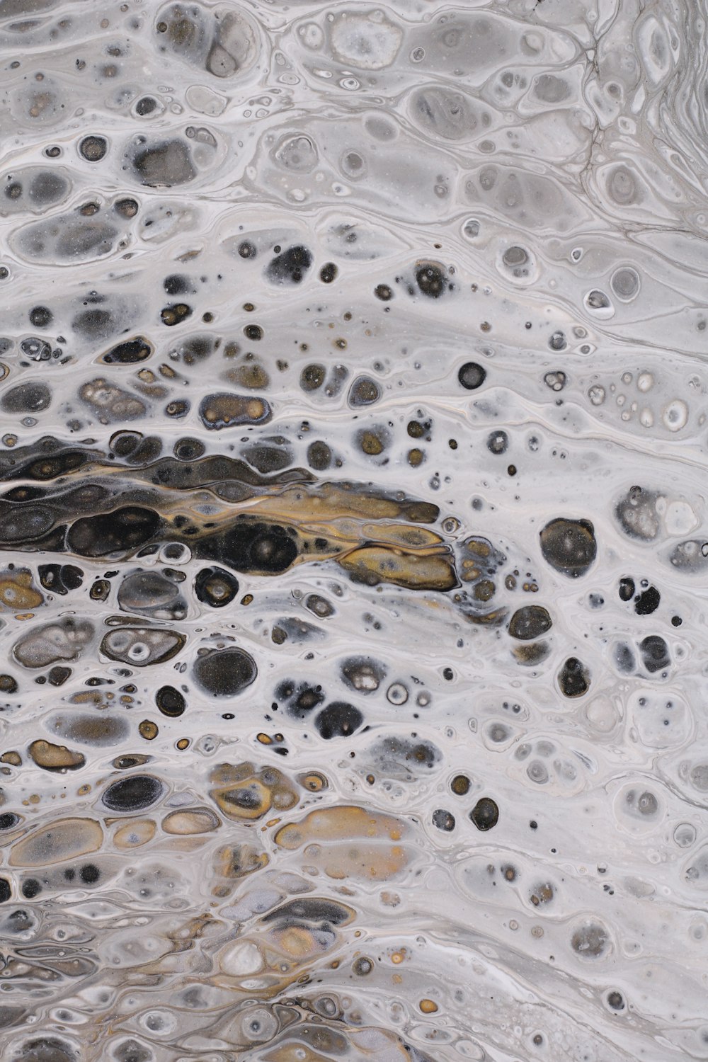 a close up of a water surface with a lot of bubbles