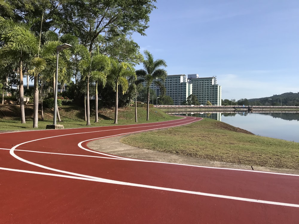 a view of a running track next to a body of water