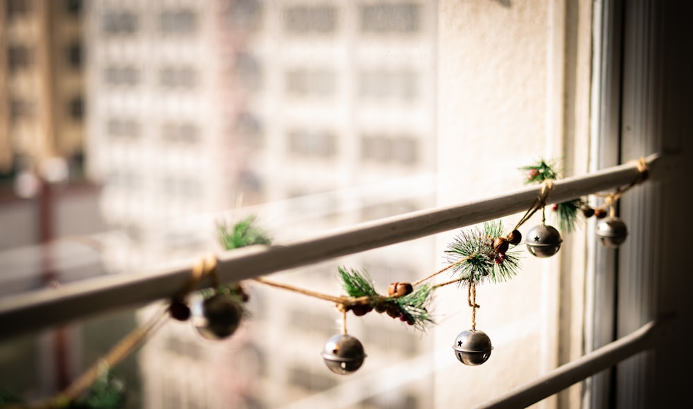 a string of bells hanging from a window