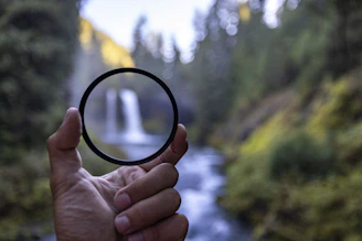 a person holding a circular object in their hand