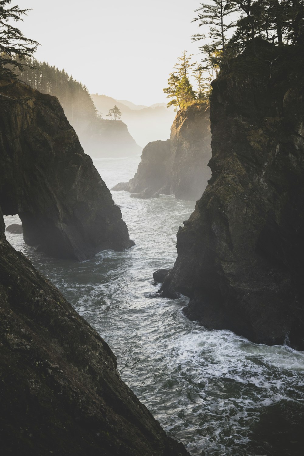 a body of water surrounded by large rocks