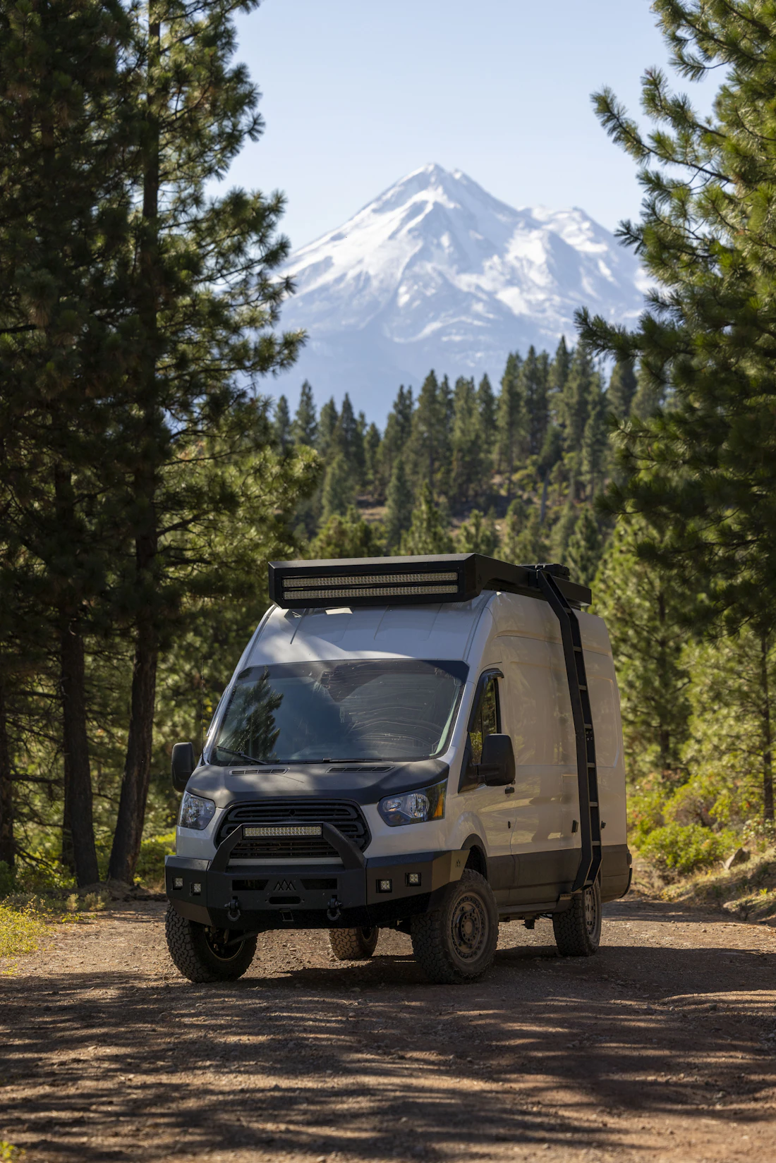 RV at a scenic site with mountains in the distance