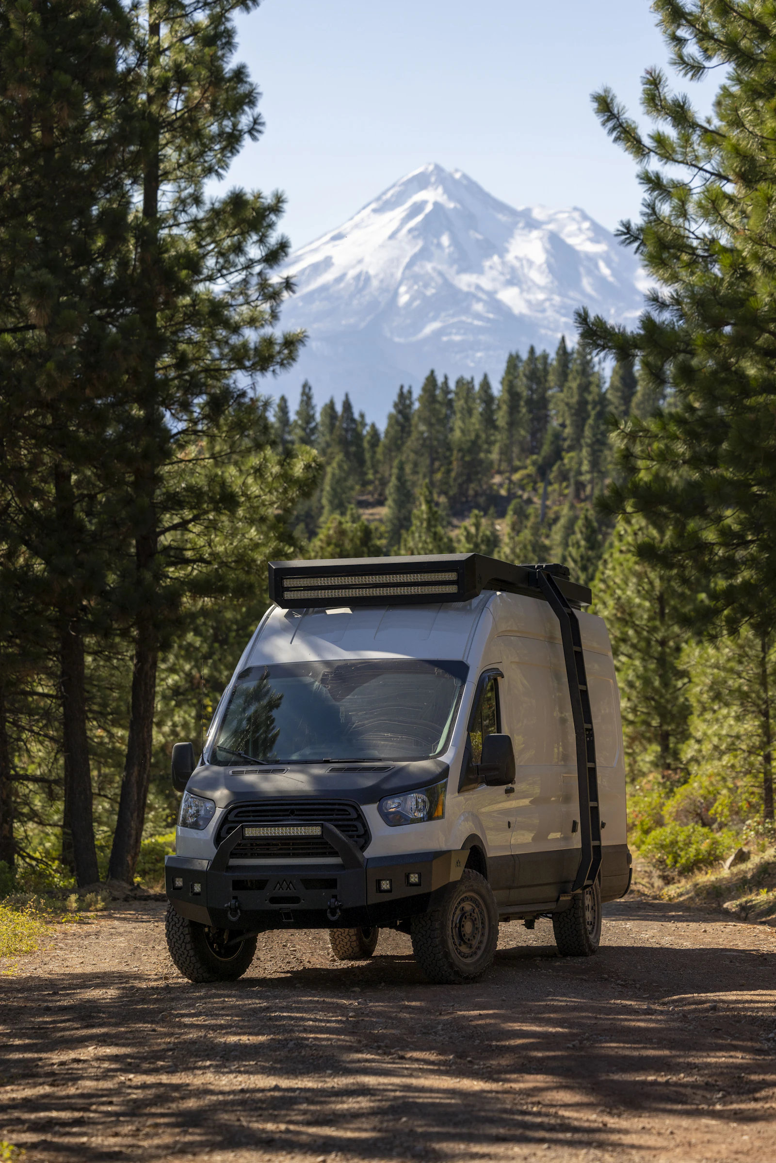 RV at a scenic site with mountains in the distance