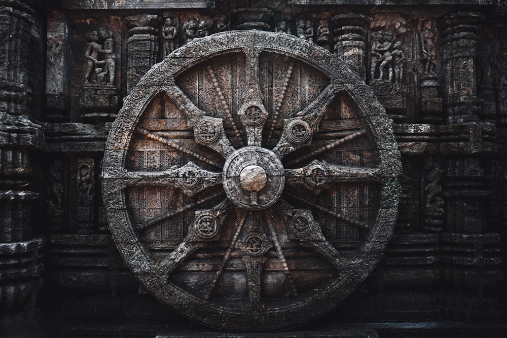 a large wheel on the side of a building