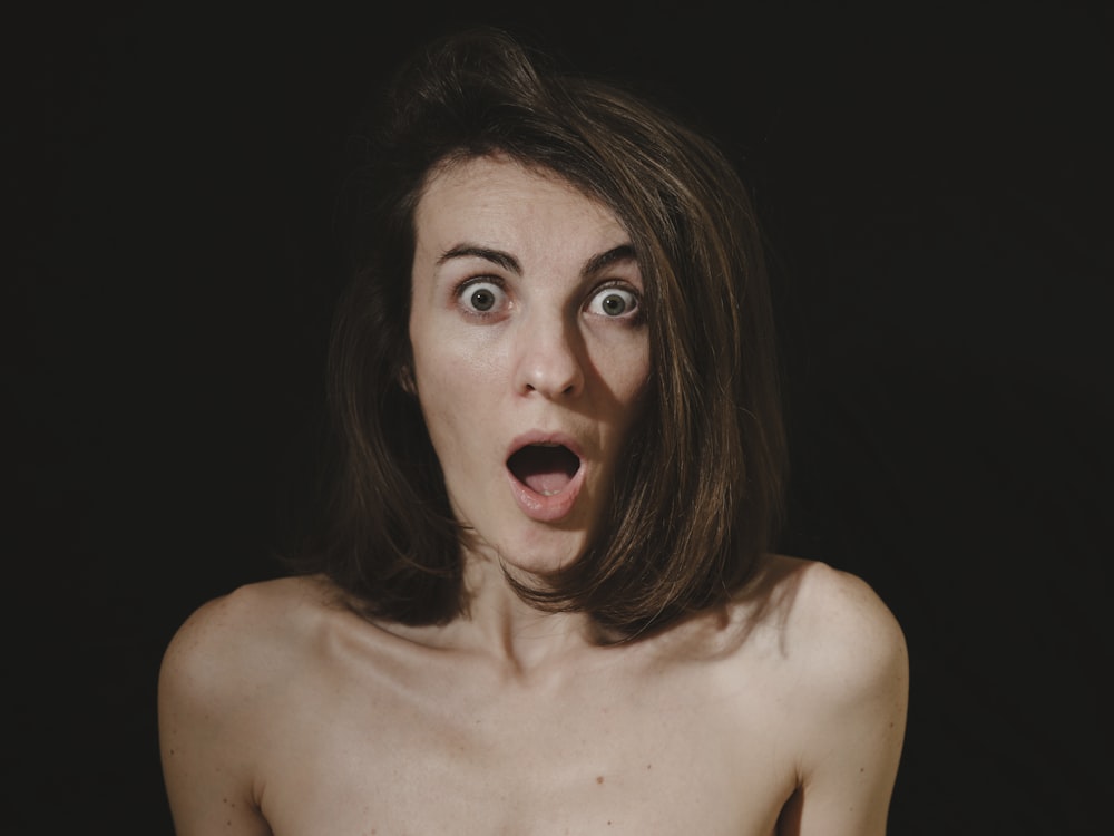 a woman with a surprised look on her face