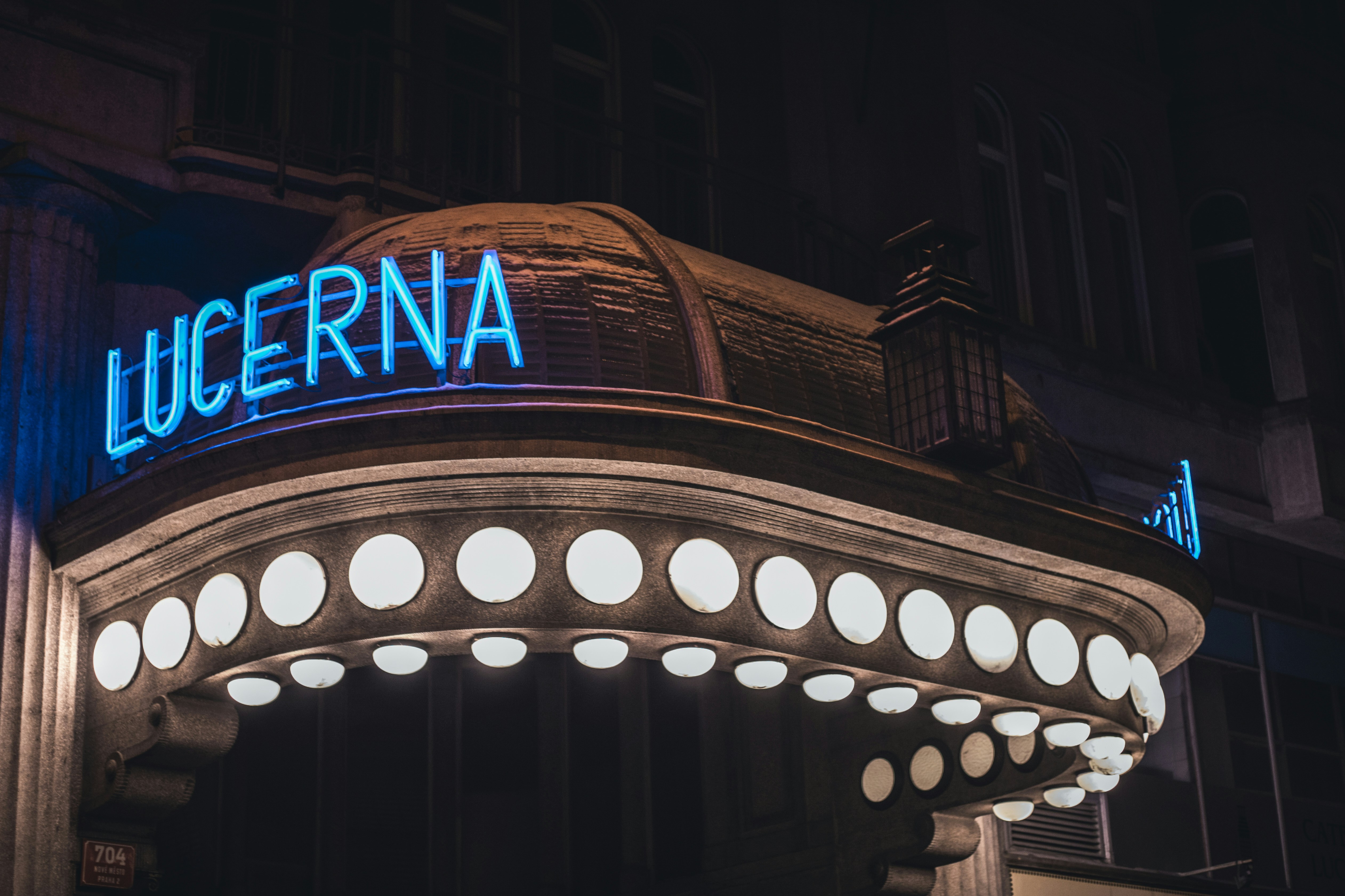 a building with a lit up sign that says lugerna