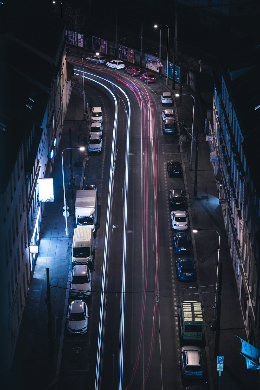 a street filled with lots of traffic next to tall buildings