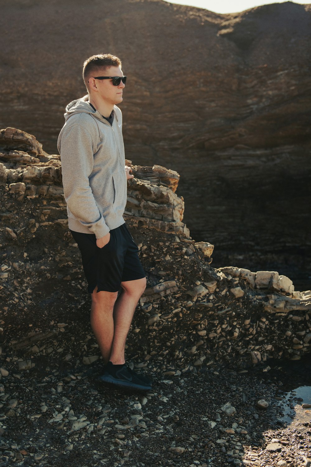 a man standing on top of a rocky mountain