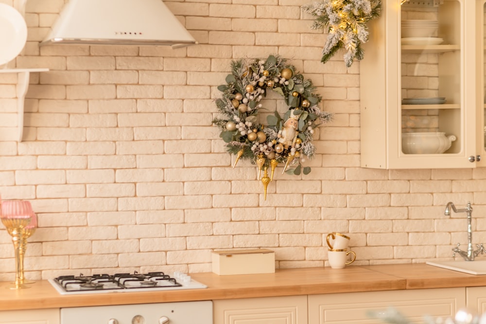 a kitchen with a wreath hanging on the wall