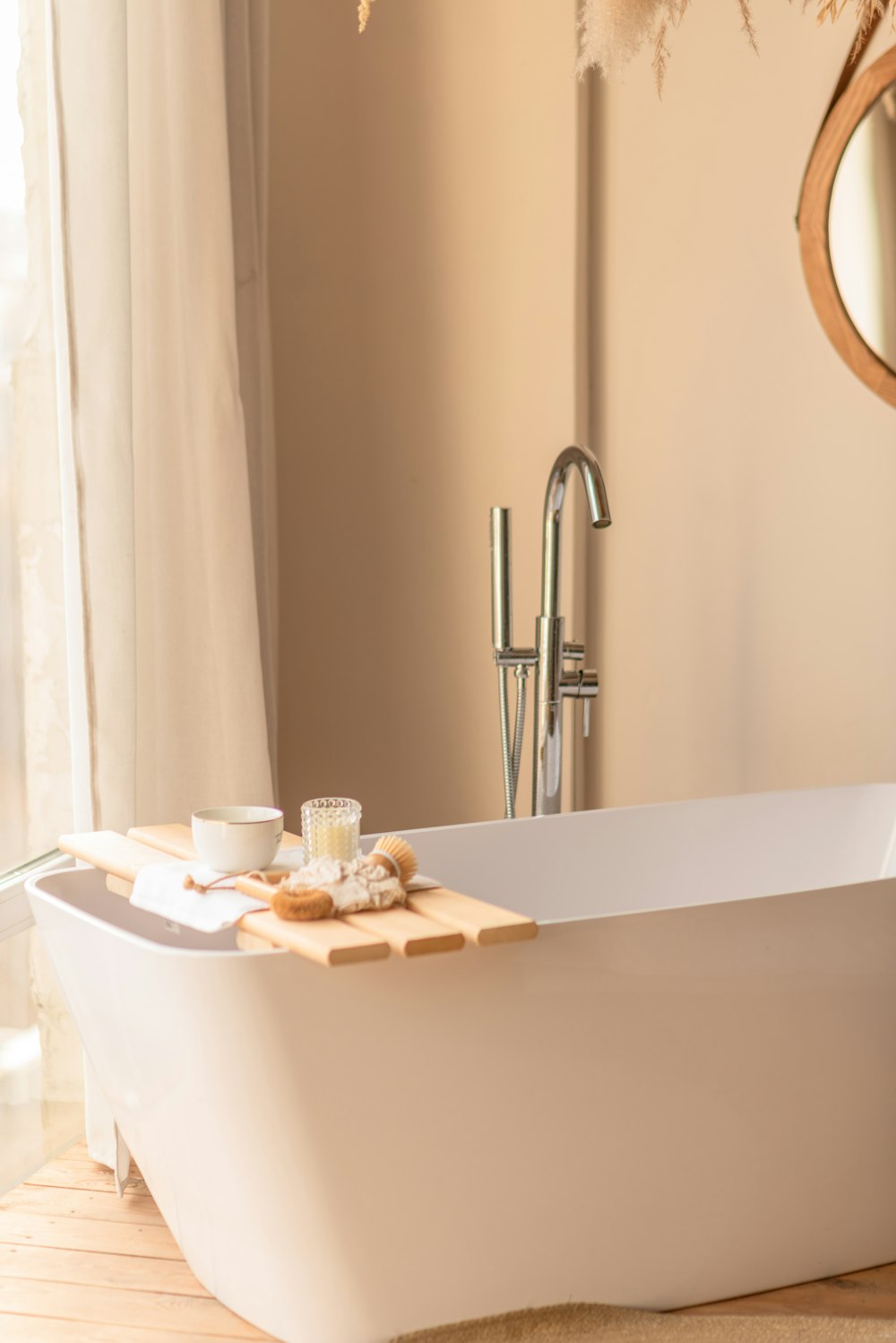 a white bath tub sitting next to a window