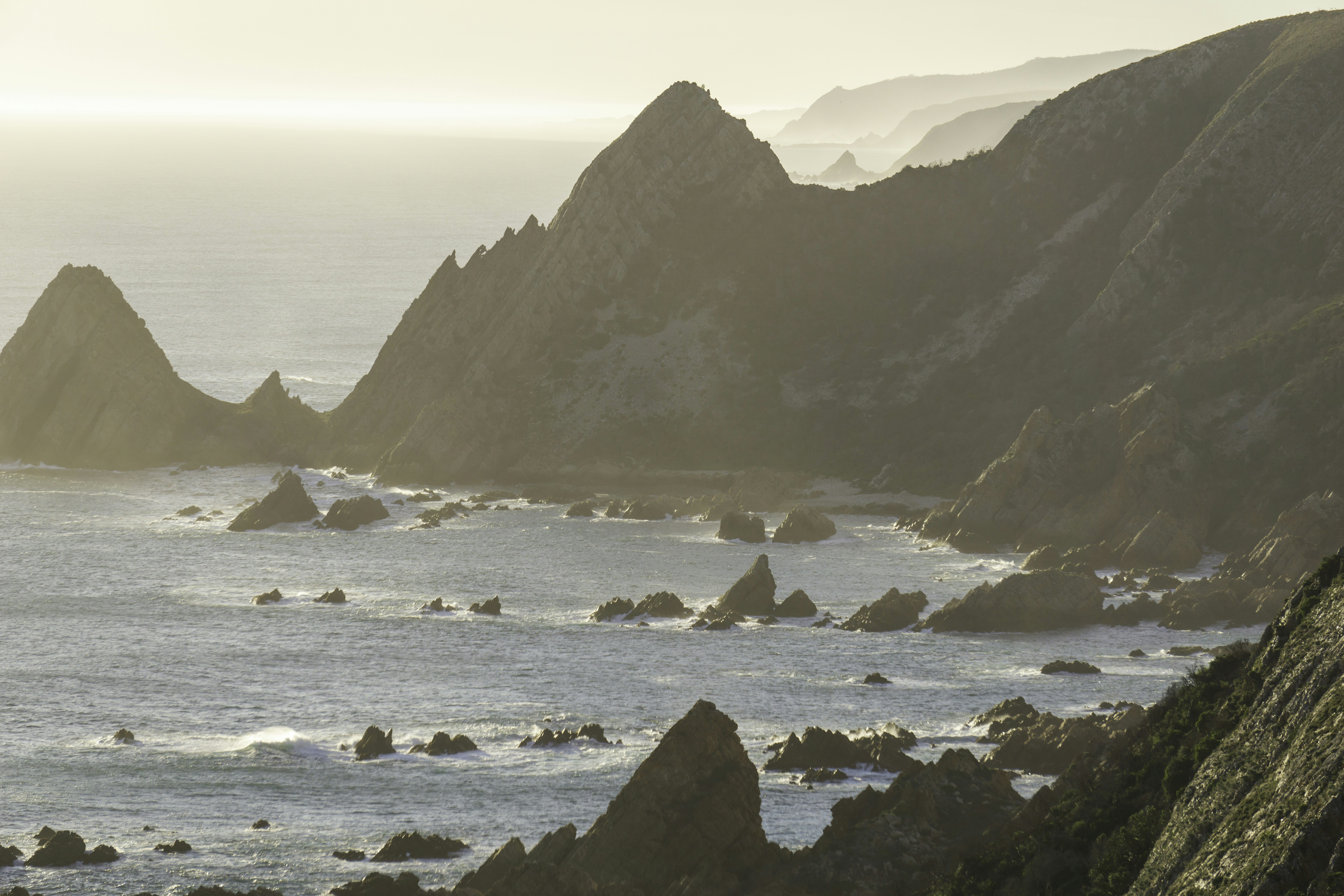 An area of the garden route coast known as ‘Kranshoek’, meaning cliff corner. Armies of jagged peaks climb towards the sky from the waters below. 