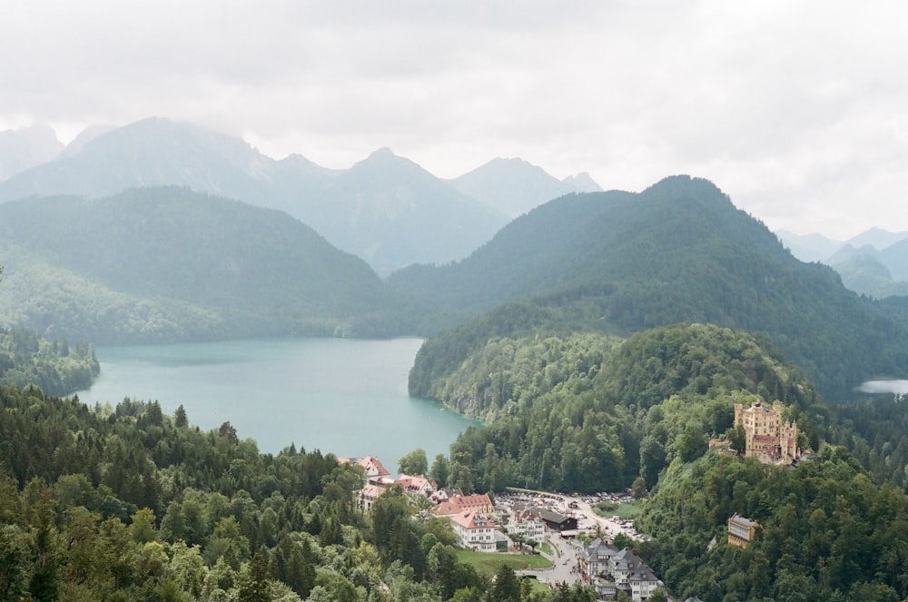 a scenic view of a lake surrounded by mountains