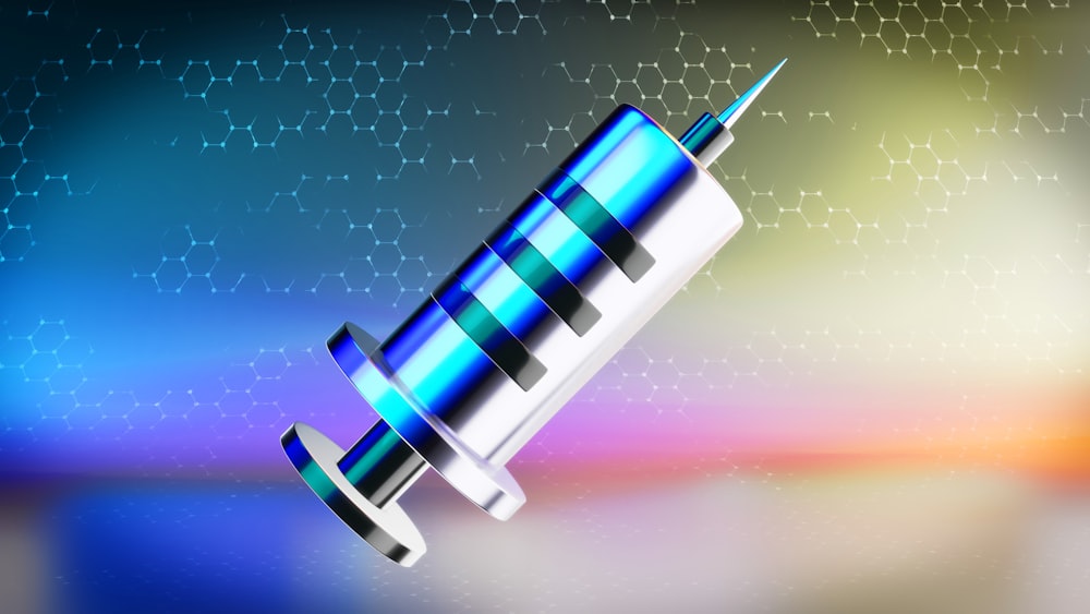 a blue and white medical device on a colorful background