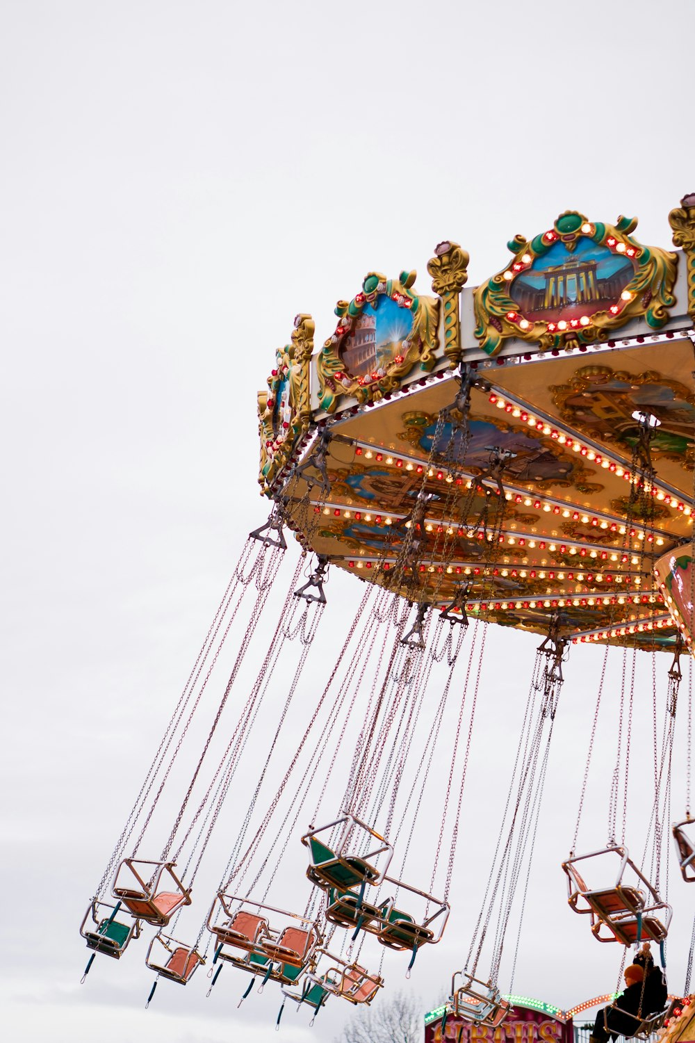 a merry go round ride with people on it