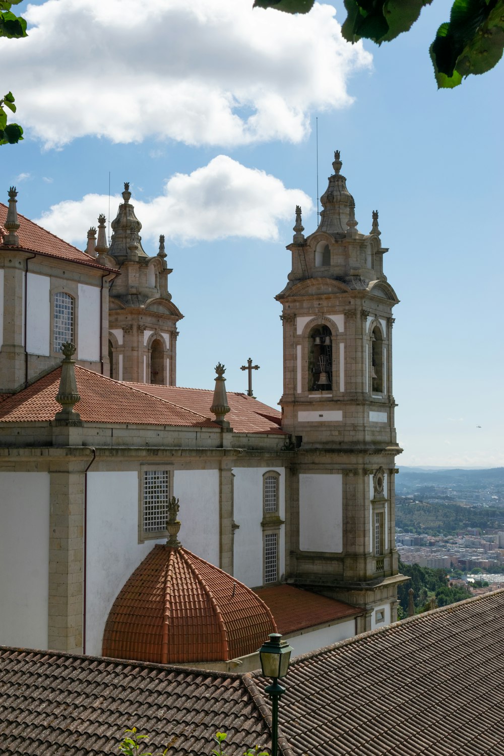 a large building with two towers and a cross on top of it