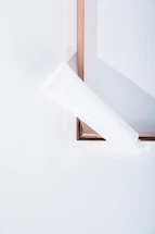 A clean, modern IV stand set against a soft white background.