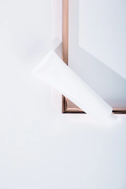 A clean, modern IV stand set against a soft white background.