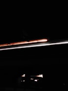 A moody, cinematic collage of creative media projects with dark tones and dynamic lighting.